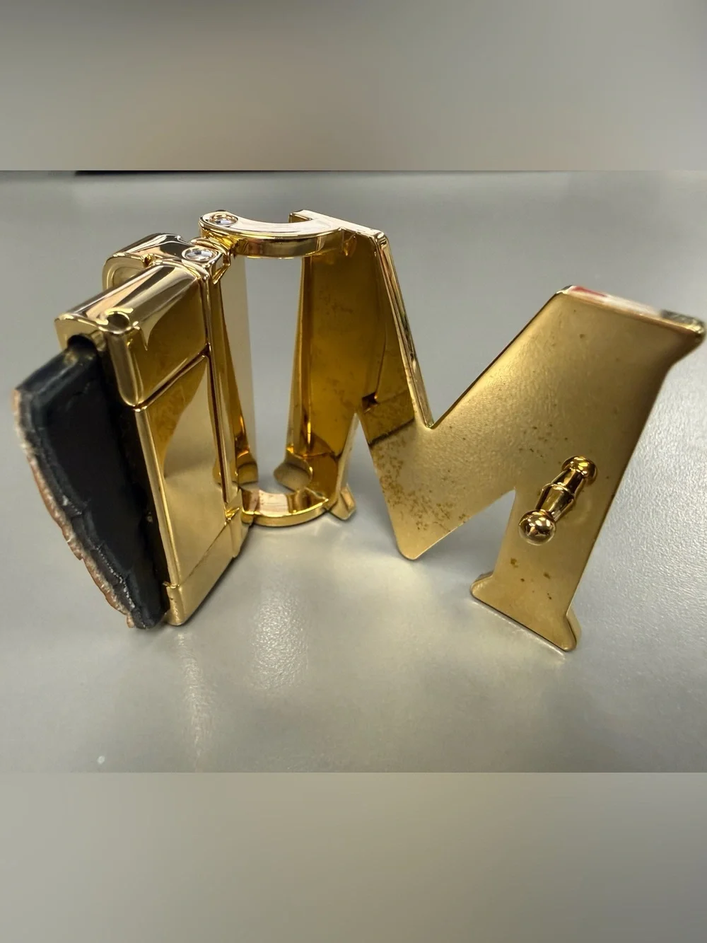 MCM Gold Tone Initial “M” Automatic Ratchet Belt Buckle Designer Logo